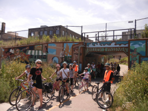Individuals on bikes near the United Community Center